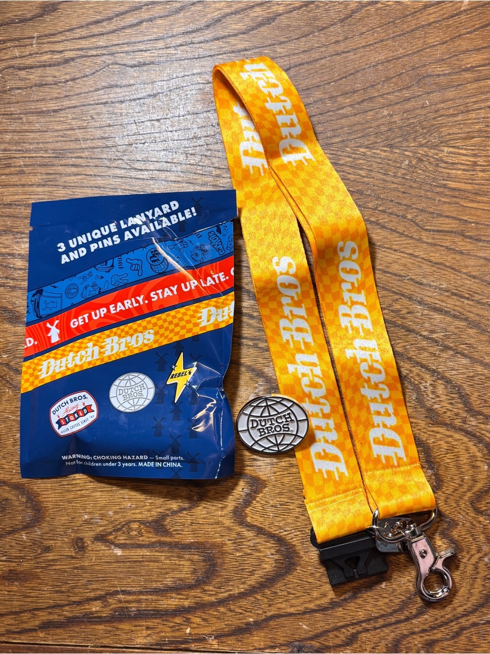 Dutch Bros Yellow Logo Lanyard with round Dutch Bros pin, June mystery drop